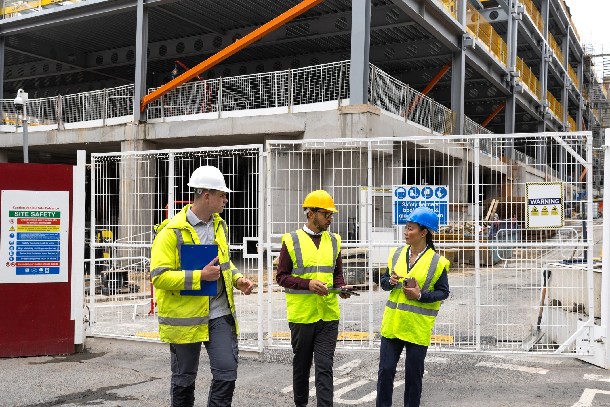 Construction safety team collaborating at an active job site